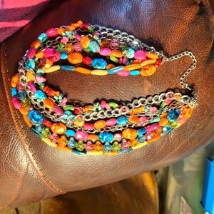 Necklace with triple chains, beads, glass, chip beads, clea colored glass.